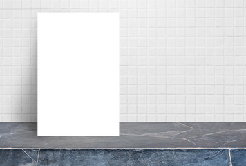 Blank White paper poster on stone table top at white ceramic tile wall,Template mock up for adding your design.