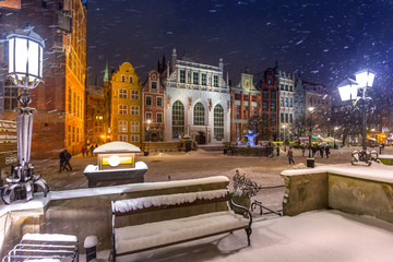 Fototapeta premium Long lane in the old town of Gdansk in snowy winter, Poland