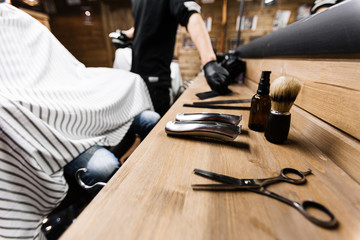 Professional haircut and shaving set on workplace of hairdresser