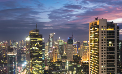 Aerial view of a stunning sunset over Jakarta business district in Indonesia capital city.