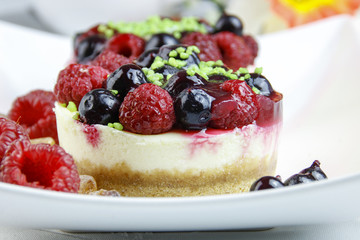 mini cheesecakes with mixed berries
