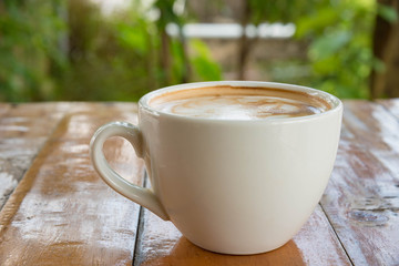 Coffee cup on woodden table
