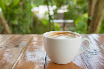 Coffee cup on woodden table