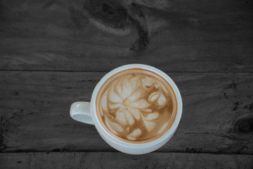 Coffee cup on woodden table