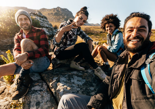 Hikers relaxing and taking selfie