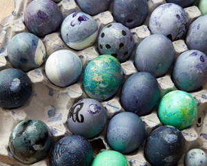 painted blue eggs in the tray