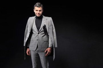 young business man wear suit on black background