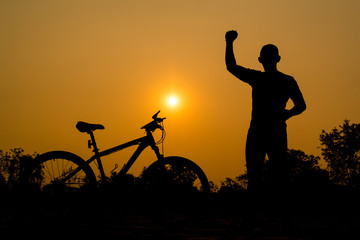 Obraz premium Silhouettes of mountain bike with man in action something