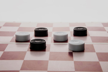 Obraz na płótnie Canvas checkers on a chess Board