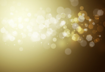 Gold sparkles glitter and rays lights bokeh abstract holiday background/texture.