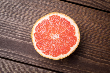 Grapefruit on wooden table. Food background