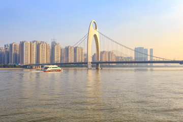 Fototapeta na wymiar Modern bridge in Zhujiang River and modern building of financial district in guangzhou city, China