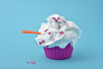 white ice cream in a pink cup