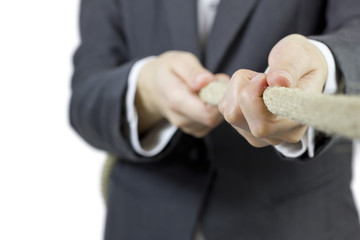 One person in business suit in a tug of war game.