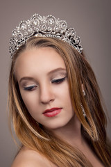Beautiful girl with a tiara on her head © pushann