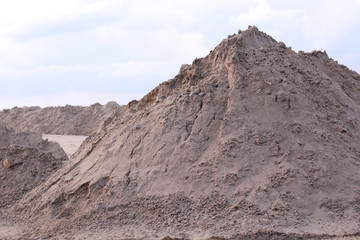 Mountain building sand on the shore sand quarry