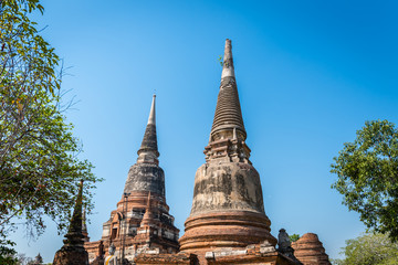 Fototapeta premium Wat Yai Chai Mongkol in Ayutthaya Historical Park . Highlight of the monastery is its very large imposing prang dominating the area. Wat Yai Chai Mongkhon, Ayutthaya, Thailand