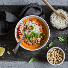 Thai  sweet potato soup with rice on the dark table, top view.