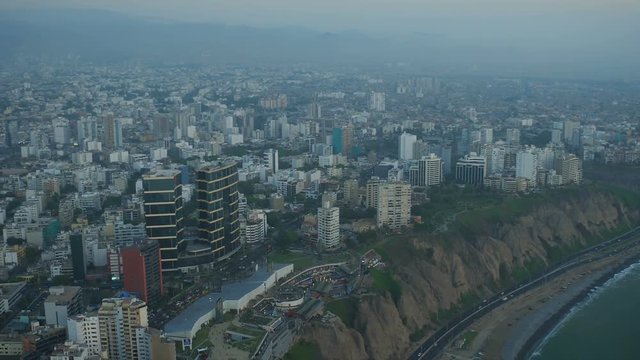 Lima Peru Aerial v66 Flying over coastline beaches panning with cityscape views.