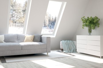 White room with sofa and winter landscape in window. Scandinavian interior design