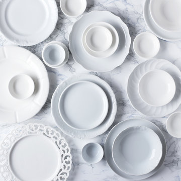 White plates on marble table