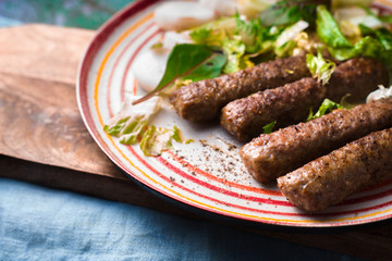 Cevapcici in the ceramic plate horizontal