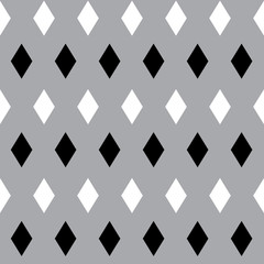Seamless pattern with black and white rhombus on grey background.