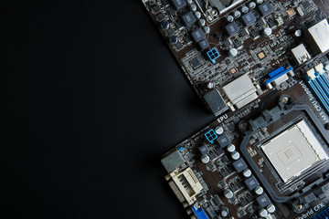 Personal computer motherboard close up on black background with copy space for your text.Technology...