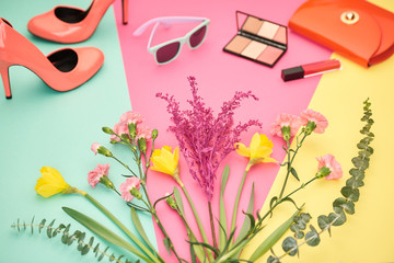 Fashion Design Spring Accessories Set, Essentials,Cosmetic.Trendy sunglasses,fashion Handbag clutch, Bouquet of multicolored flowers. Glamor shoes heels, Summer lady Essentials. Creative Concept. Art.