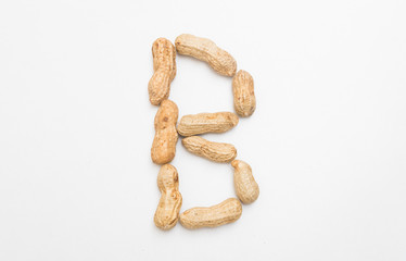 Closeup of peanut  in B english alphabet isolated on white background