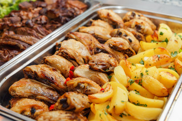 Heated cages with meat dishes