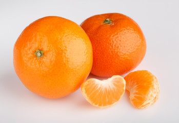 Ripe mandarin close-up on a white background. Tangerine orange. Colorful Food and drink still life concept. Fresh fruits and vegetables on color background. Clementine. Citrus. Fresh fruits. Diet.
