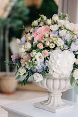 Beautiful wedding bouquet in stone vase, closeup