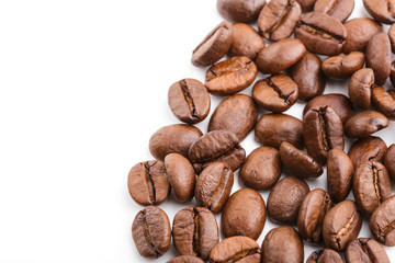 roasted coffee beans isolated in white background. Roasted coffee beans background close up. Coffee beans pile from top on white background with copy space for text. Good morning.