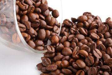 roasted coffee beans isolated in white background. Roasted coffee beans background close up. Coffee beans pile from top on white background with copy space for text. Good morning.