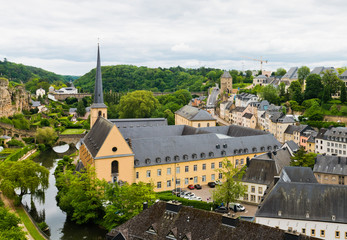 View on the Grund district of Luxembourg City with Neumuenster Abbey and Alzette river
