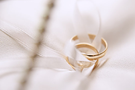 Wedding Rings On A White Lace Pillow