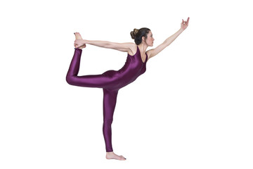 Fototapeta premium Young slim woman practicing yoga in the studio