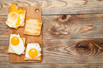 toast and egg on wooden table