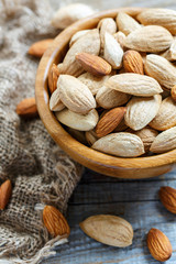 Wooden bowls with almond nuts.