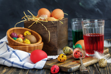 Eggs and glass jars with paint, preparation for Easter.