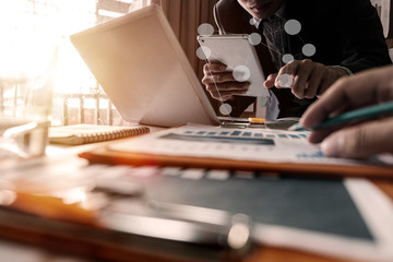 Business team meeting present.professional investor working with new startup project. Finance managers task.Digital tablet laptop computer design smart phone in morning light
