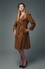 Spring french look. Gir in coat and beret. Chic and business style