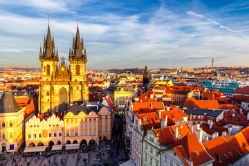 Obraz premium Old Town of Prague, Czech Republic. View on Tyn Church and Jan Hus Memorial on the square as seen from Old Town City Hall. Blue sunny sky