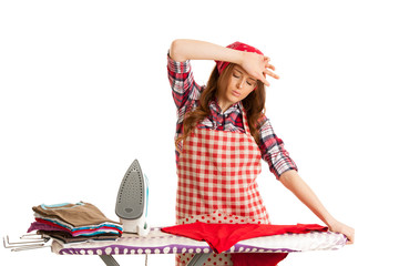 Fototapeta premium Tired woman ironing isolated over white background