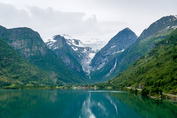 Obraz na płótnie Canvas Briksdalsbreen glacier view from the fjord water.