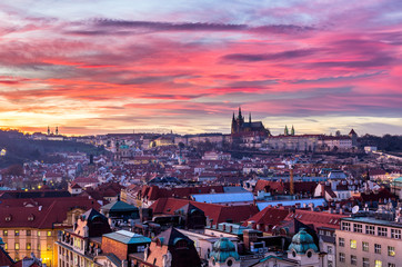 Most mystical and mysterious city in Europe. Prague through the eyes of birds with magnificent sunset and sky over the traditional houses with red roofs. Old town square, Prague, Czech Republic