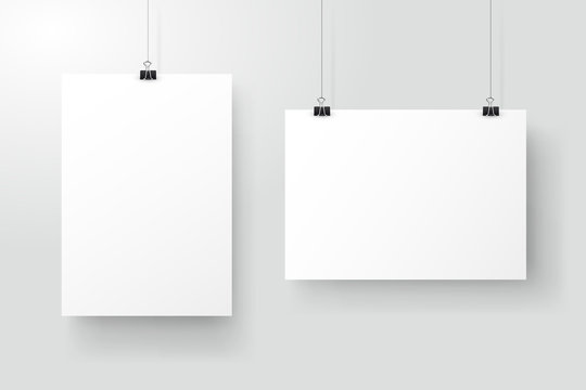 White posters hanging on binder. Grey wall with mock up empty paper blank. Layout mockup. Vertical and horizontal template sheet.