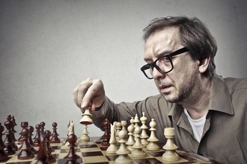 Concentrated man playing chess