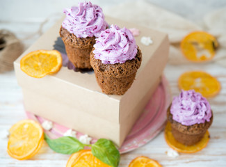 Chocolate muffins with berry cream for a holiday
